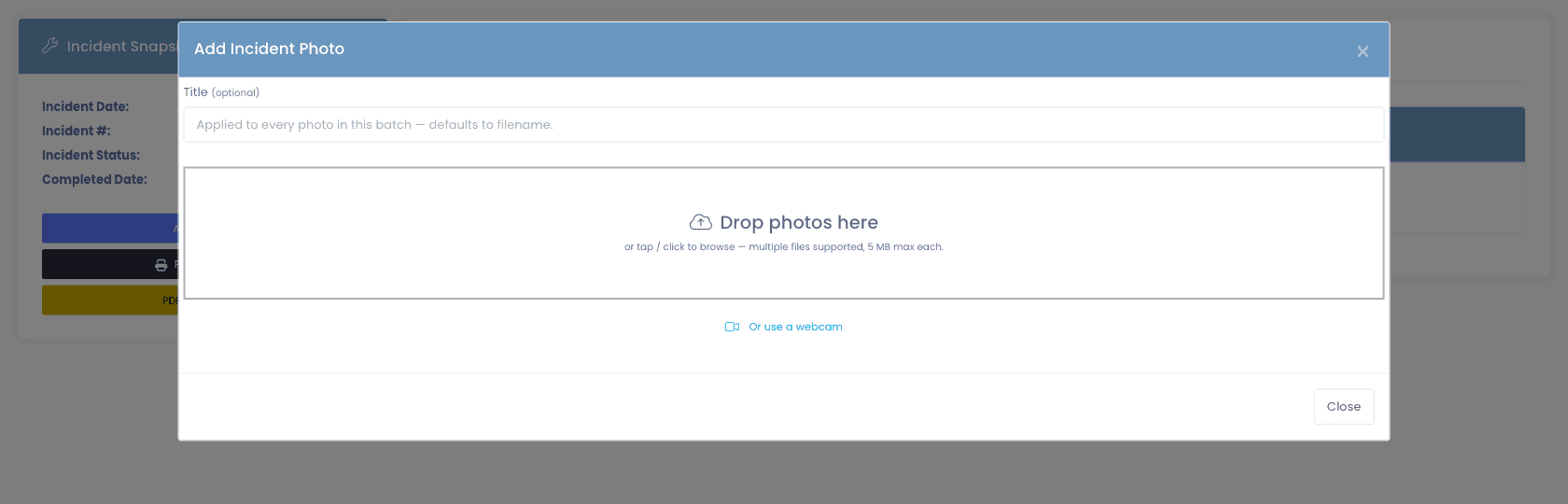 Add Incident Photo modal, title field, drop-photos drop zone with multi-file support, and a "Or use a webcam" option for capturing damage directly from the help-desk machine